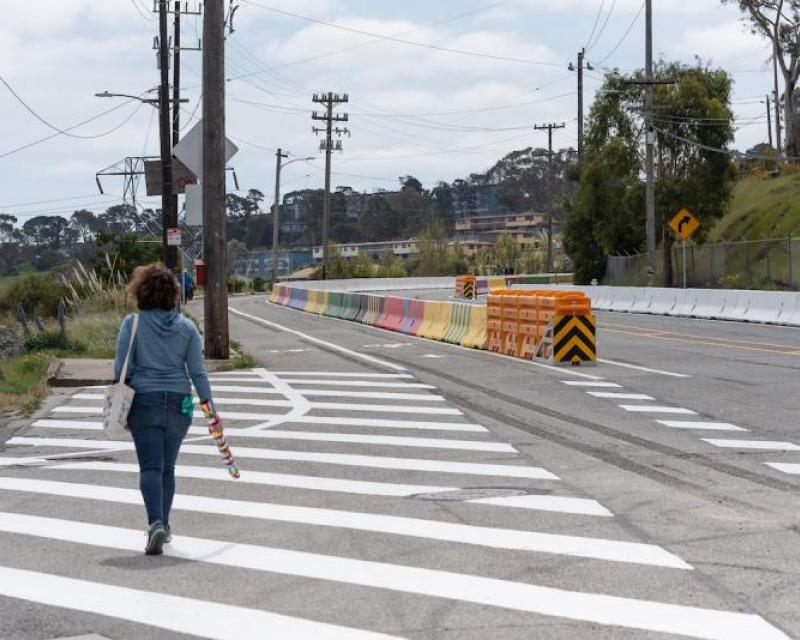 Pedestrian walking along Hunters Point Boulevard