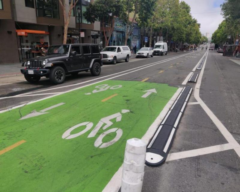 Center running two-way bike lane on Valencia Street. 