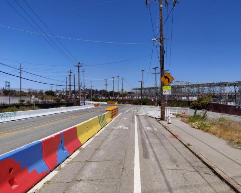 Protected bikeway with mural on Hunters Point Boulevard