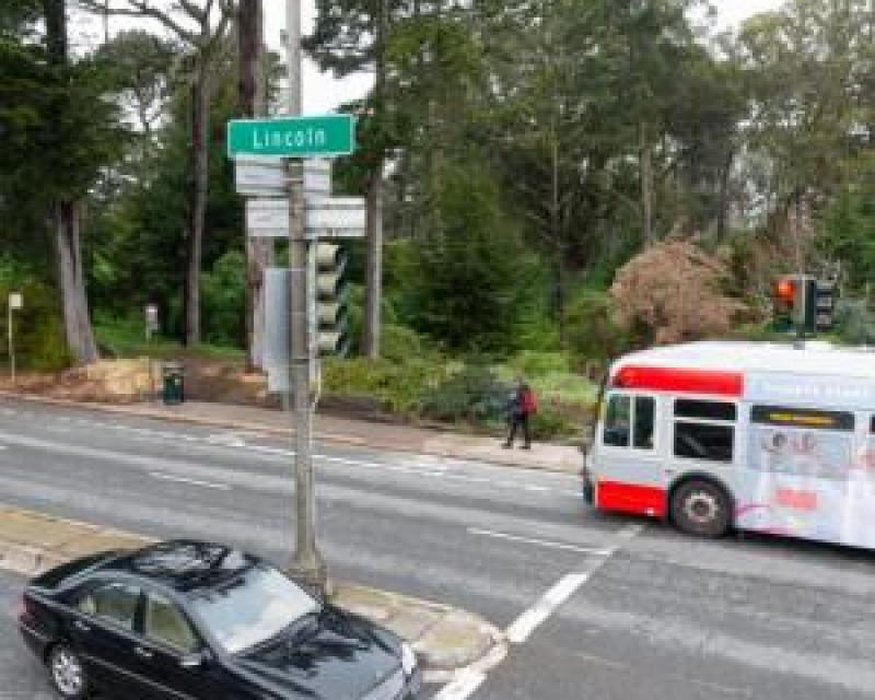 Intersection on Lincoln way, automobile, bus, and pedestrian present 