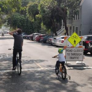 people bikeing on Noe Street