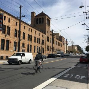 Person biking along Bryant Street travel lane
