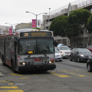 28 19th Ave bus on Lombard St going through green light at intersection