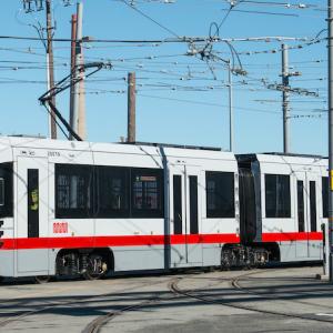 New Muni train in rail yard.