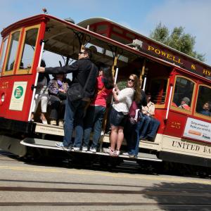 Cable car riders travel uphill