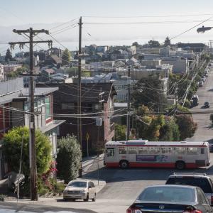 19 Polk bus driving through Potrero Hill with neighborhood and bay views in background