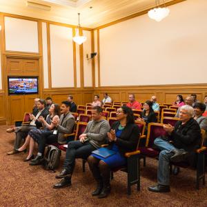 group of people seated in board room audience