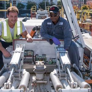 Men working on a bus in our maintenance yard.