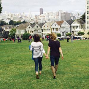 Couple walking through Alamo Square Park