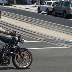 Motorcycle crossing an intersection.