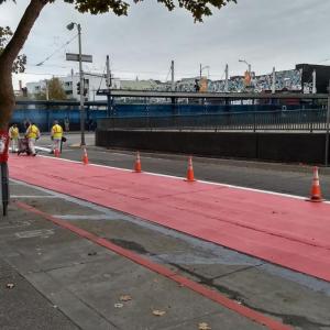 Red lanes being painted on Geary.