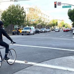 People biking along Valencia.