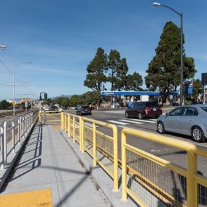 New pedestrian refuge for people walking across 19th Avenue.