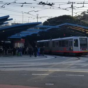A busy morning for pedestrians, cars and trains at West Portal
