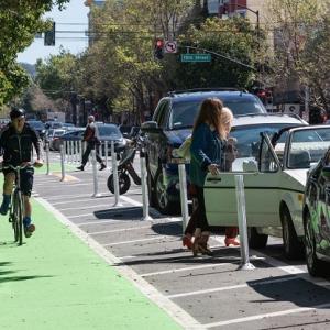 Man biking on the Valencia Street bike path