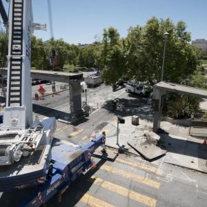 Image of cranes and crews removing the bridge at Geary and Steiner