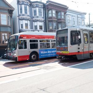 Photo of a Muni bus and Muni Metro side by side