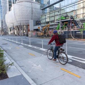 person biking in a two-way bikeway on Beale Street