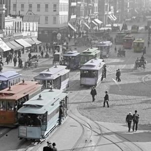 colorized photo of cable cars on market street at ferry building