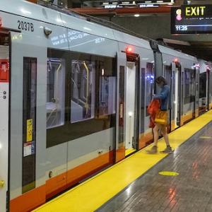 Passengers entering and exiting train at Church Station