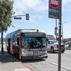 Photo of the 28 19th Avenue bus with a passenger boarding