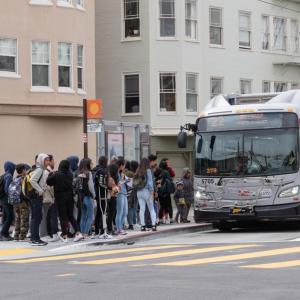 Students board a Muni bus