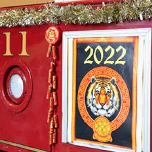 Photo showing a Year of the Tiger sign on Cable Car 11, decorated for the upcoming Lunar New Year festivities