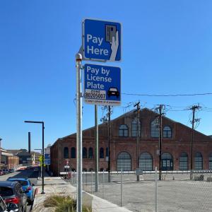 Pay Here and Pay by License Plate parking meter signs