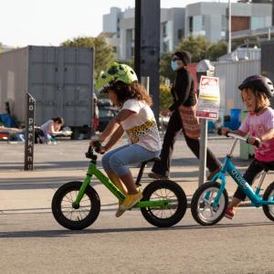 Children biking on a Slow Street