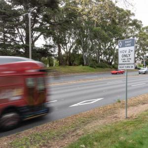 bus driving on high occupancy vehicle lane on park presidio 