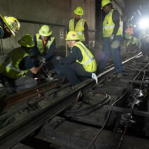 Track Department team drilling holes in new rail for Embarcadero Crossover during Fix It! Week, April 21, 2022.