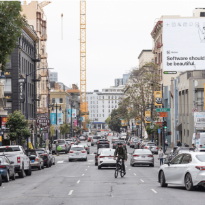 Showing three southbound travel lanes on Hyde Street with cars and a cyclist