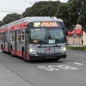 Muni bus traveling in the transit lane on Geary Boulevard