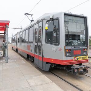 J Church train waiting at stop for customer to board. 