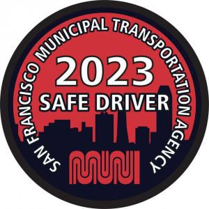 Badge with the text "San Francisco Municipal Transportation Agency 2023 Safe Driver" and the Muni worm logo