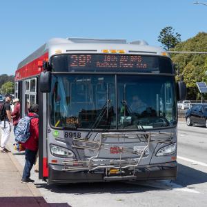 People boarding the 28R bus on 19th Avenue.