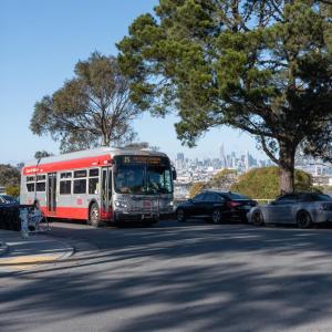 Muni line 15 with the San Francisco skyline in the background