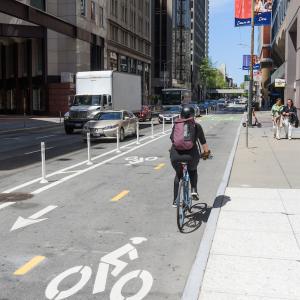 cylclist in two-way protected bike lane 