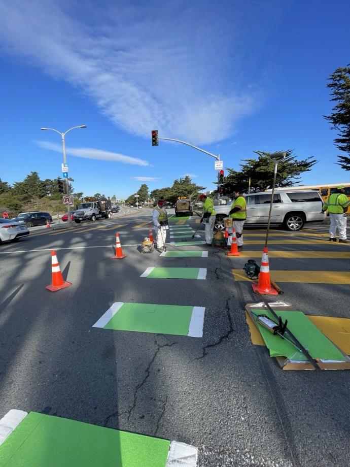 SFMTA Crews installing bike lane green thermoplastic