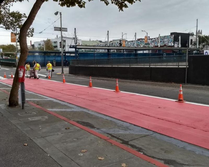 Red lanes being painted on Geary.