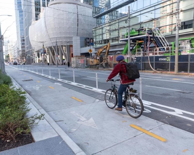 person biking in a two-way bikeway on Beale Street
