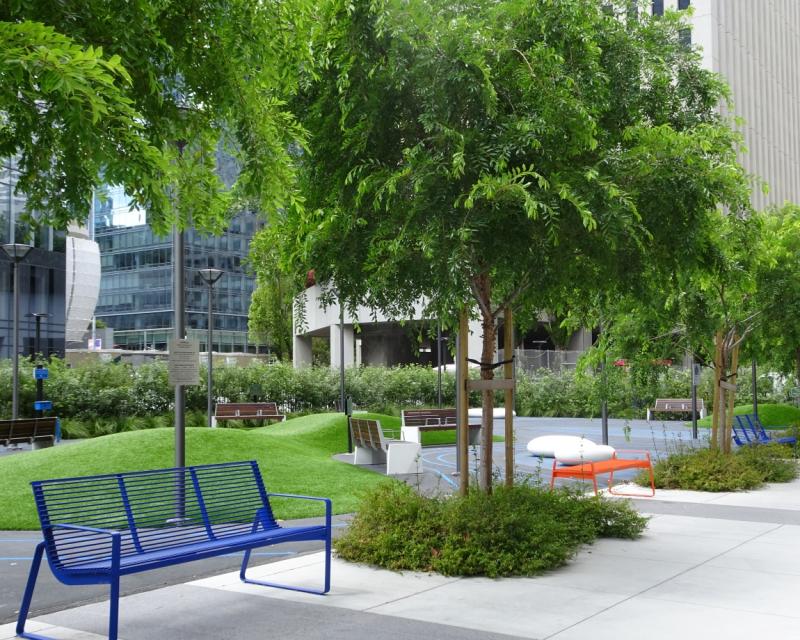 Recent trees and seating along Urban Park at the intersection of  Main and Howard streets